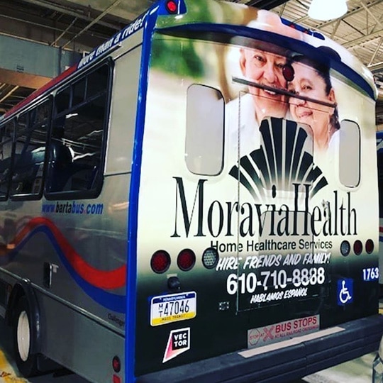 Moravia Health bus wrap advertisement